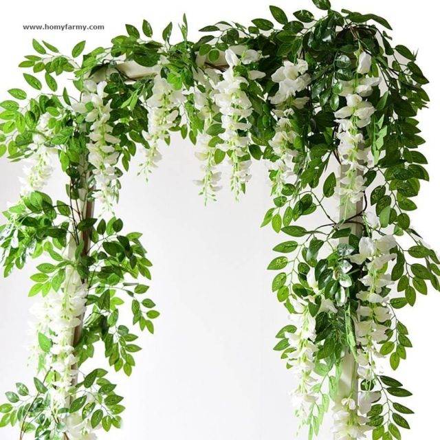Artificial Flower Decorative Garland Decoration  Homy Farmy https://homyfarmy.com https://homyfarmy.com/2m-wisteria-artificial-flowers-vine-garland-wedding-arch-decoration-fake-plants-foliage-rattan-trailing-faux-flowers-ivy-wall/